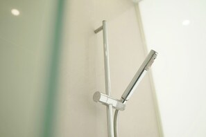 Shower, free toiletries, slippers, towels