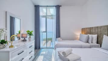 Deluxe Apartment, 2 Bedrooms, Sea View, Beachfront | 2 bedrooms, desk, iron/ironing board, free WiFi