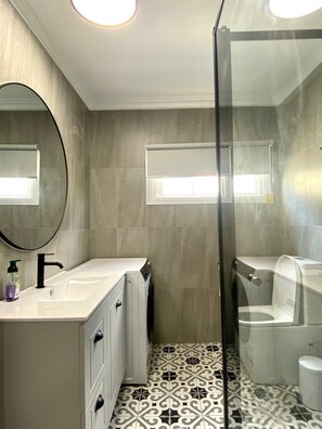 Shower, hair dryer, towels, soap