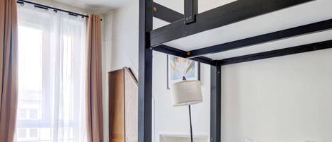 1 bedroom, desk, iron/ironing board, travel crib