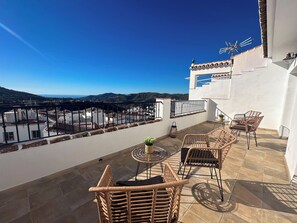 Deluxe Suite, Multiple Beds, Private Bathroom, Sea View | Terrace/patio