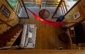 Honeymoon Cabin, Hot Tub, Lagoon View | Living area | 50-inch Smart TV with digital channels, Netflix, pay movies - Morada de Rashid - Banheira de Imersão (Imbituba)