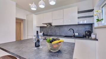 Fridge, coffee/tea maker, cookware/dishes/utensils