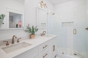 Shower, eco-friendly toiletries, hair dryer, towels