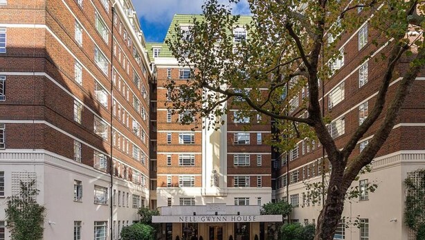 A multi-story building with a prominent entrance labeled "NELL GWYNN HOUSE." - Modern London Nell Gwynn House Apartment (London)