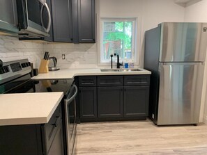 Fridge, microwave, oven, stovetop - Two-Bedroom Wellington Apartment (Prince Edward)