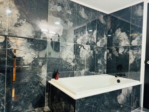 Jetted tub, hair dryer, towels, soap