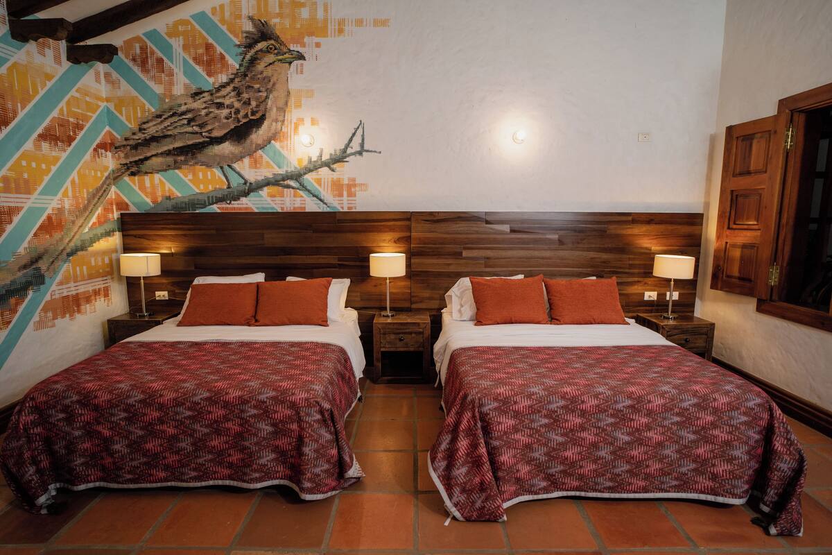 Deluxe Quadruple Room, Pool View | In-room safe, desk, laptop workspace, bed sheets