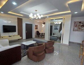Economy Apartment, Balcony, City View | Living area - The9 by Naji Apartments (Abuja)