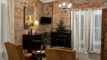 Deluxe Suite, Non Smoking, Kitchenette | Living area | 24-inch Smart TV with digital channels