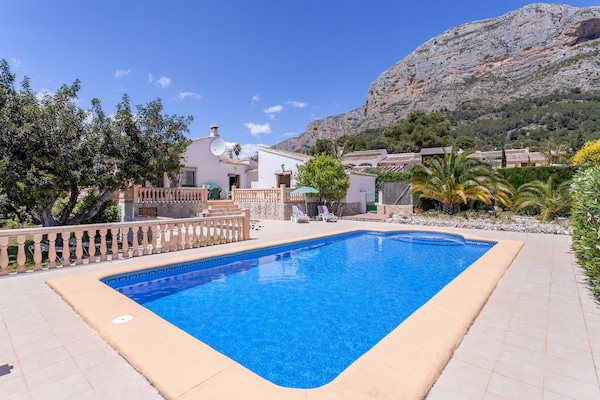 Photo looking back at the house from the pool edge