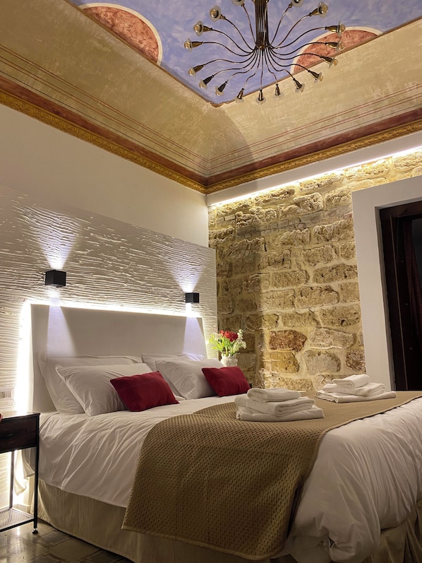 Deluxe Triple Room, Courtyard View | In-room safe, desk, laptop workspace, soundproofing