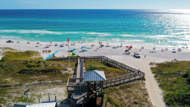 A beach with a wooden boardwalk leading to a small pavilion. - Golf Cart Included, 3 Pools, Steps to Beach, Pickleball (Santa Rosa Beach)