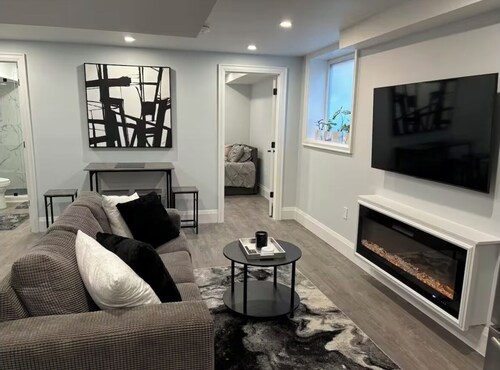 Modern, clean, bright two bedroom lower level look out duplex with large windows