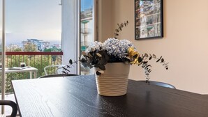 A potted plant on a balcony table with a city view. - Il Faro luxury rooms & lounge (La Spezia)