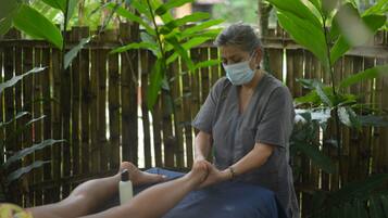 Guests can enjoy a rejuvenating massage in a serene outdoor setting.