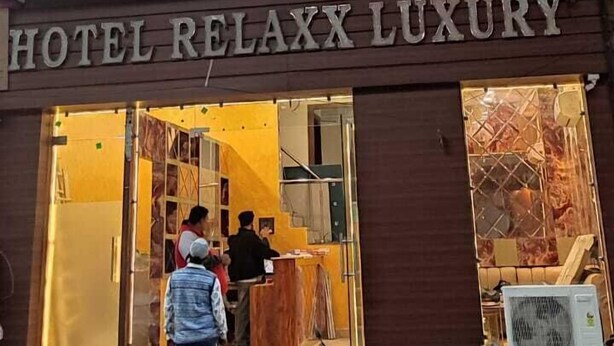 A two-story building with a sign reading "HOTEL RELAXX LUXURY". - Hotel Relaxx Luxury (Amritsar)