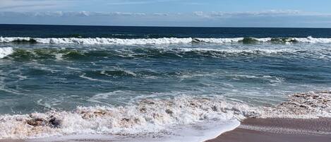 On the beach, sun loungers, beach towels
