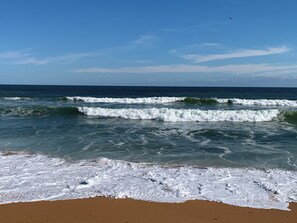 On the beach, sun loungers, beach towels