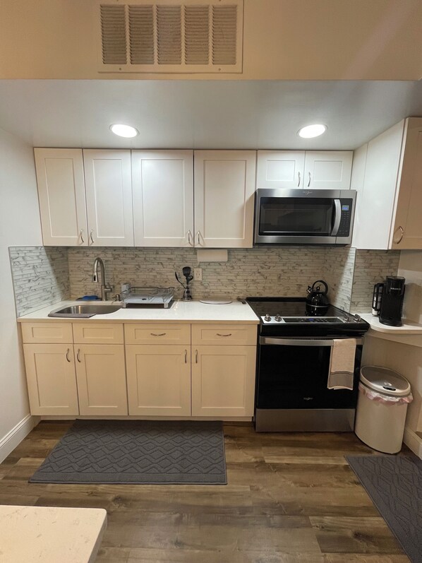 Fridge, microwave, stovetop, coffee/tea maker