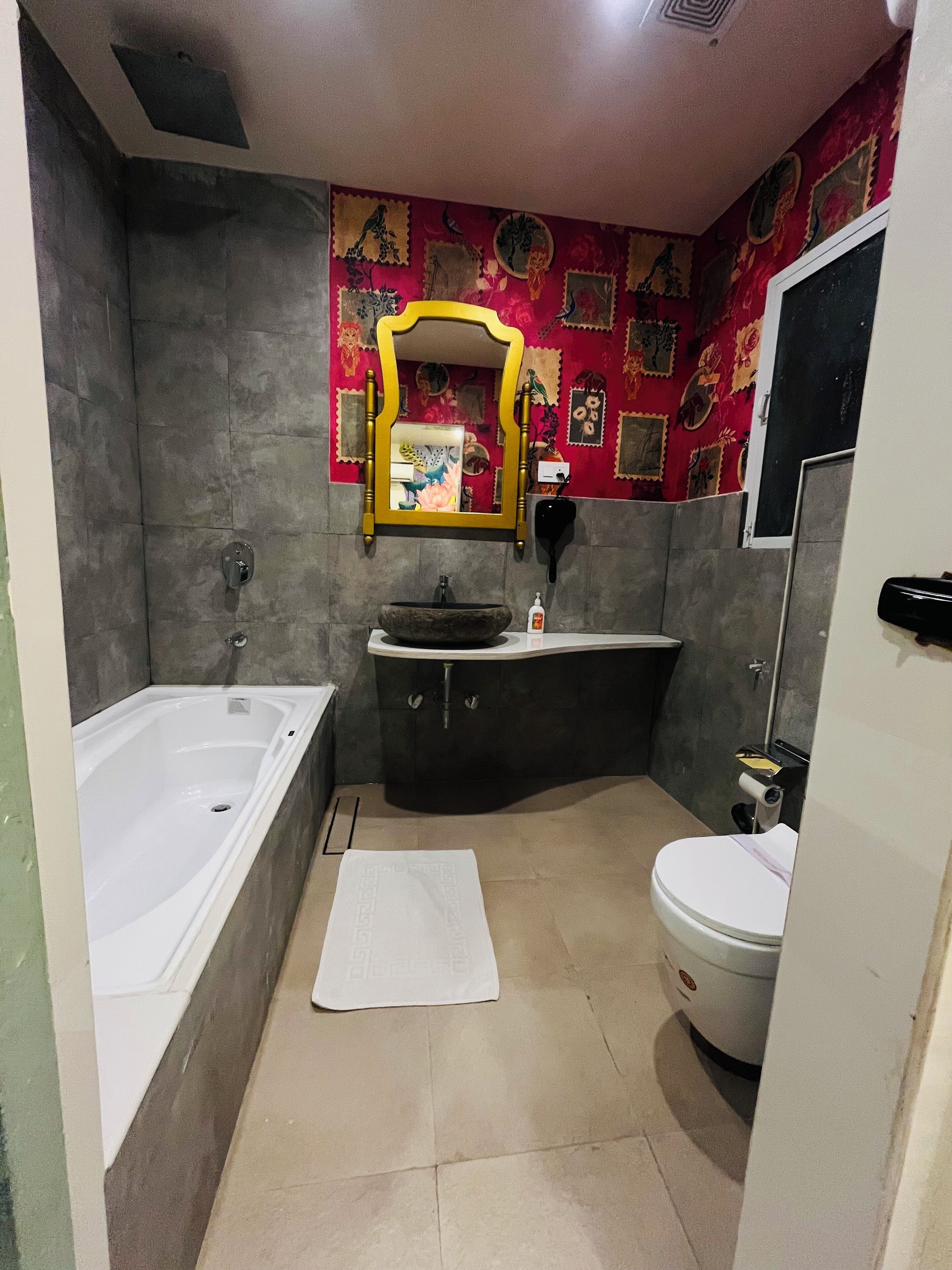 A bathroom with a bathtub, sink, and toilet.