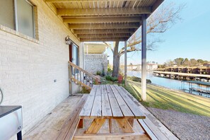 Outdoor dining - Spacious Lakefront Retreat with Game Room, Private Dock, and Scenic Views (Hot Springs)