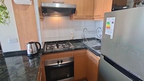 Apartment | Private kitchen | Microwave, stovetop, cookware/dishes/utensils