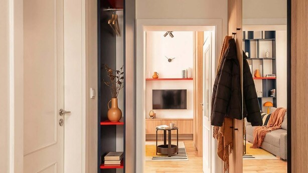 A modern hallway with a TV, shelves, and a sofa in the background. - TurnKey | Wenceslas square Loft Apartment V (Praha 1)
