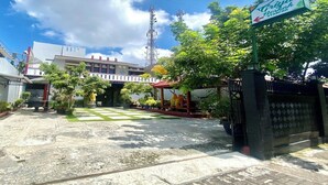A gated entrance with a sign for 'Grijya Berjiah Syariah'. - Berkah Syariah (Kutoarjo)