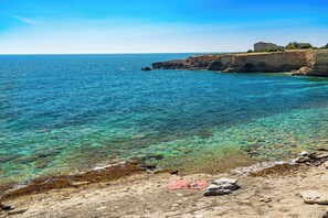 On the beach, sun loungers
