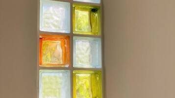 A wall with six square panels, each with a different color.
