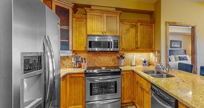 Inviting ski-in/out condo with private hot tub, fireplace & elevator