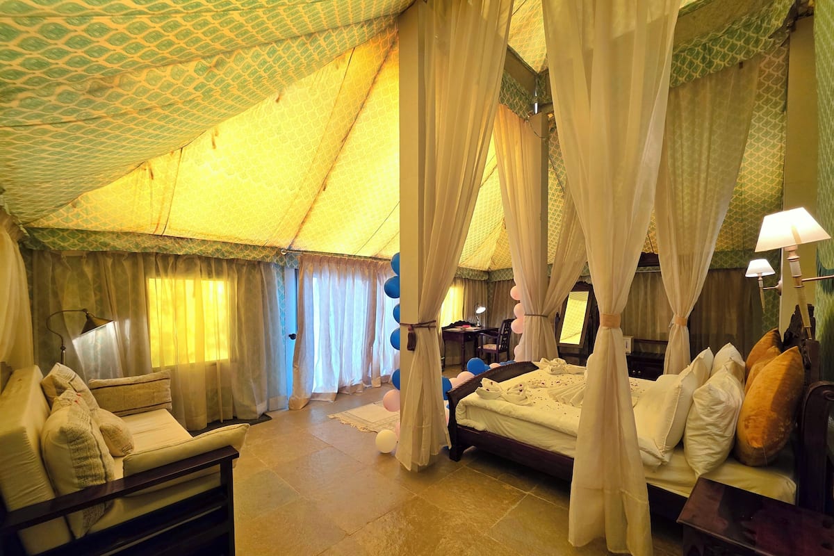 Luxury Suite, Garden View | 1 bedroom, in-room safe, desk, laptop workspace