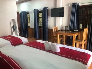 Deluxe Triple Room, Courtyard View | Desk, laptop workspace, free WiFi