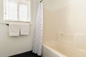 Shower, jetted bath, hair dryer, towels