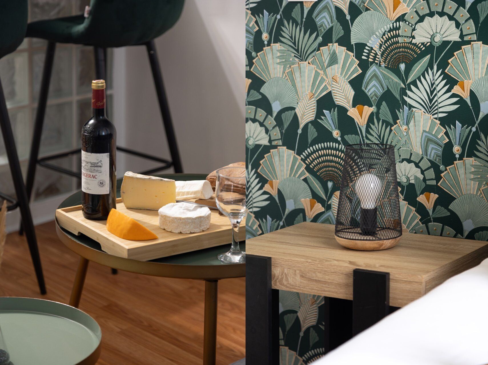 A table with a bottle of wine, cheese, and a glass, set against a floral wallpaper background.