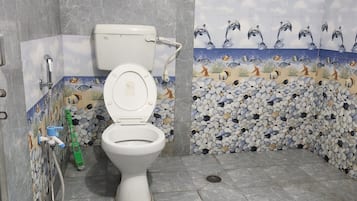 Basic Triple Room | Bathroom | Shower, slippers, towels, soap