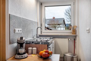 Fridge, stovetop, coffee/tea maker, cookware/dishes/utensils