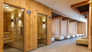 A sauna room with wooden walls and benches, a glass door, and a sign indicating temperature and bio-safety. - Modern Apartment With Balcony (Fiss)
