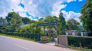 A sign for Vihar Holiday Resorts with a restaurant in the background. - Vihar Holiday Resorts (Araku Valley)