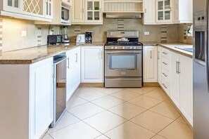 Fridge, microwave, stovetop, cookware/dishes/utensils