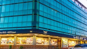 The OLE-KEN Hotel with a modern glass facade and a visible restaurant at the ground level. - The Ole-Ken Hotel (Nakuru)