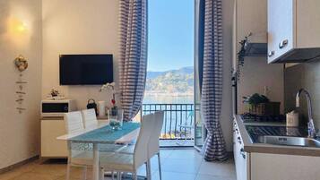 Superior Suite, Balcony, Beach View | Living area | 32-inch flat-screen TV with digital channels, TV