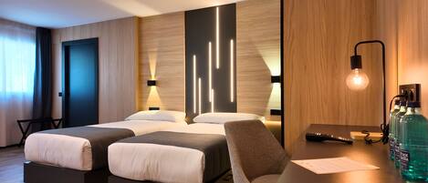 Family Room | Select Comfort beds, desk, laptop workspace, blackout drapes