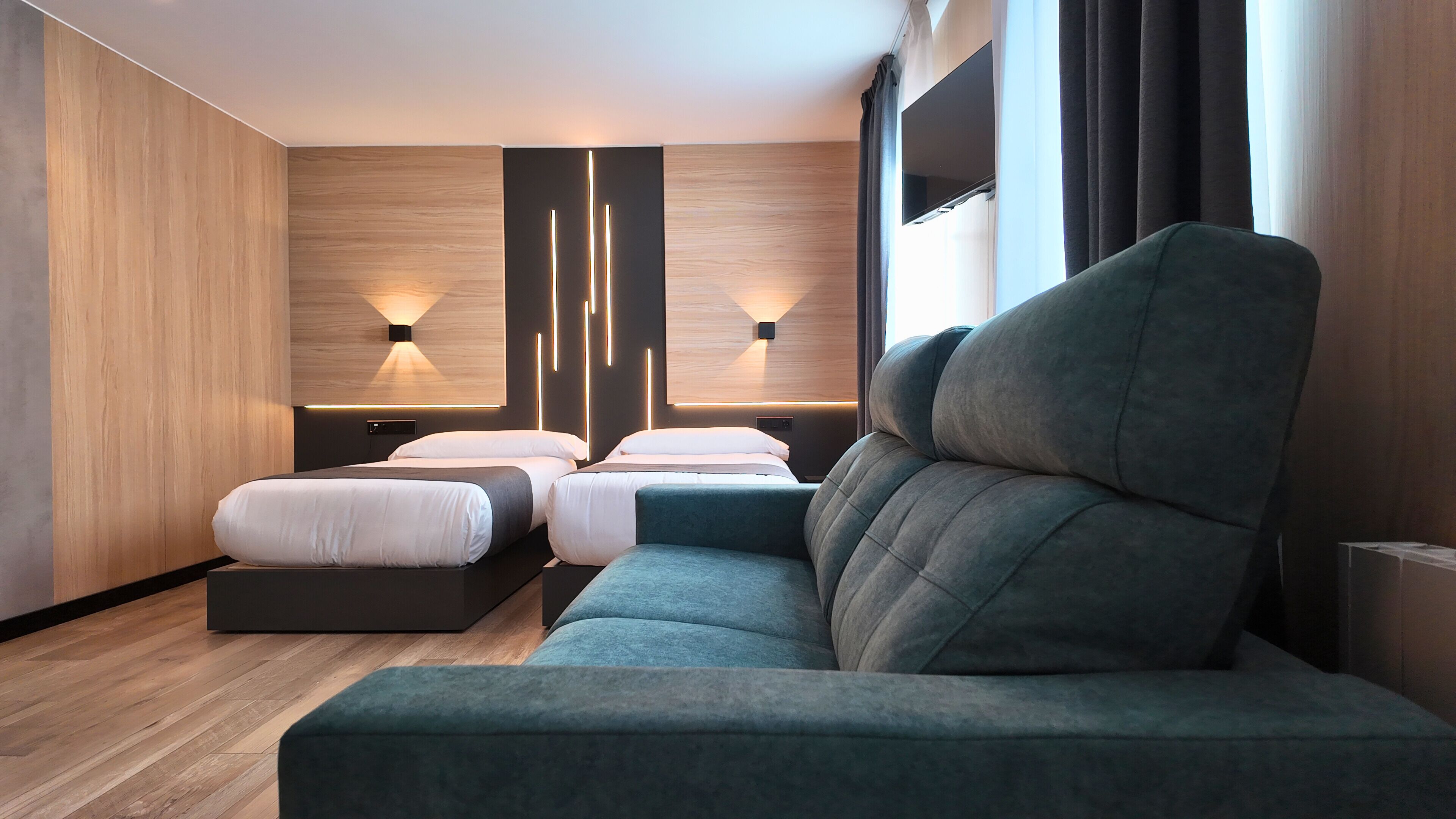 Family Room | Select Comfort beds, desk, laptop workspace, blackout drapes