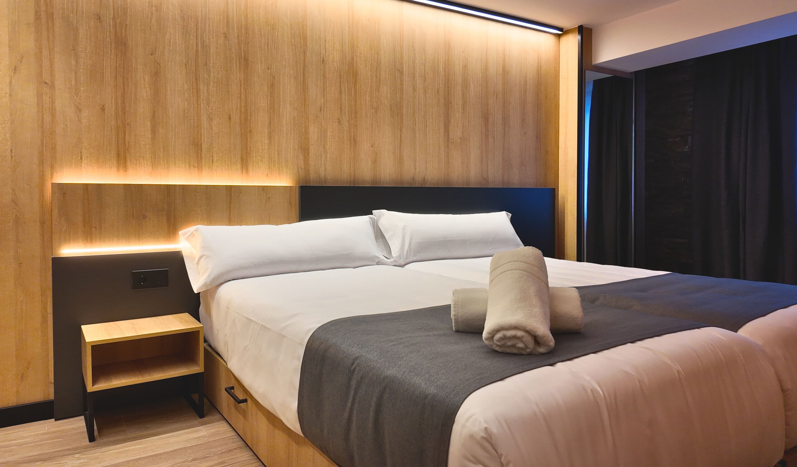 Premium bedding, memory-foam beds, desk, laptop workspace