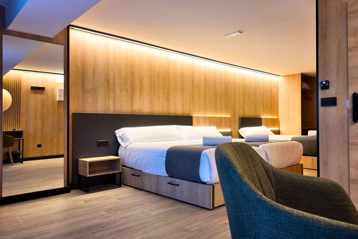 Premium bedding, memory-foam beds, desk, laptop workspace