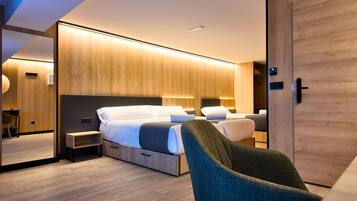 Premium bedding, memory-foam beds, desk, laptop workspace