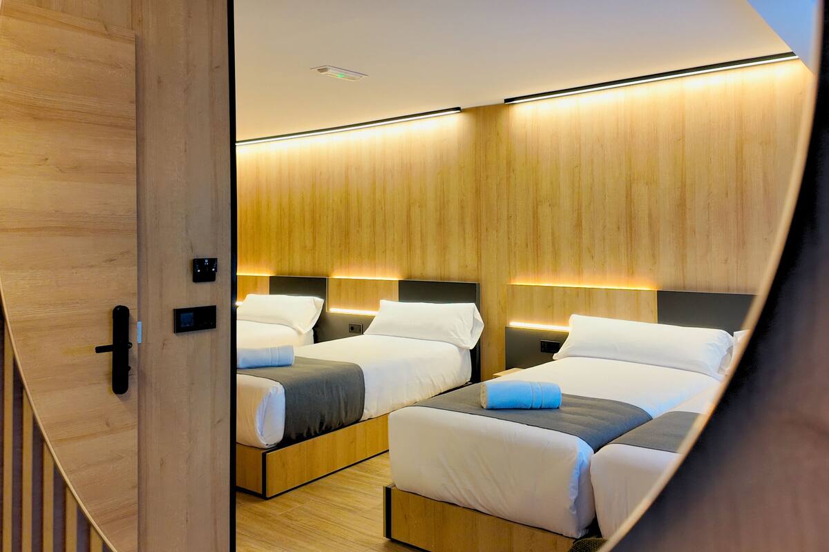 Premium bedding, memory-foam beds, desk, laptop workspace