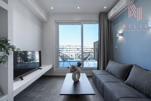 Panoramic Studio, Balcony, City View | Living area | Flat-screen TV, offices - V1 Boutique Residences, Nilie Hospitality MGMT (Thessaloniki)